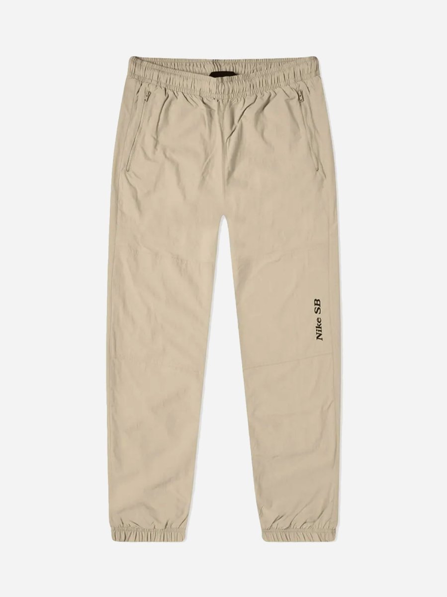 M NK SB Y2K GFX TRACK PANT - GRAIN/VELVET BROWN - Munk Store